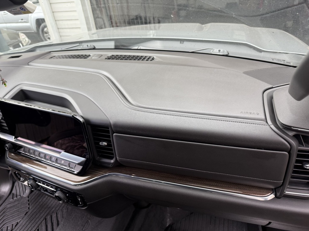 Freshly detailed luxury car in a dark showroom
